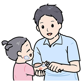 幼児に外用薬を塗る親