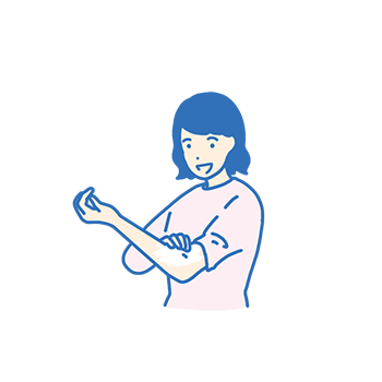 ひじの内側に薬を塗る女性