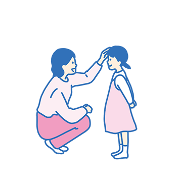 女の子の頭をなでる母親