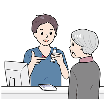 チューブ薬の説明をする薬剤師