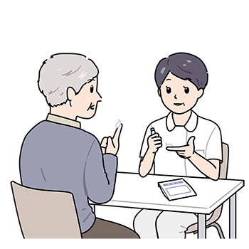 チューブ薬の説明をする看護師(女性)