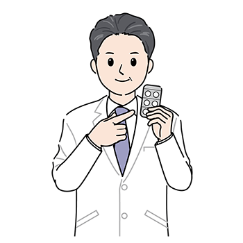 錠剤を持つ医師(男性)
